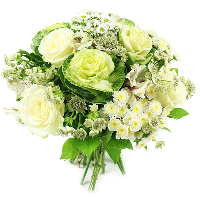 Captured against a bright, seamless white background, this hand-tied bouquet showcases a sophisticated monochrome blend of white, cream, and green, designed with the care and precision of an experienced local florist from the Nine Elms area. At the visual centre sit decorative heads of ornamental kale, also called flowering cabbage, their layered, ruffled leaves forming compact rosettes that shift from a rich, cool green around the edges to a soft chartreuse and pale lime in the middle. Around these sculptural blooms, several white and creamy ivory roses are in full bloom, their petals opening in generous spirals, suggesting a soft, romantic fragrance and a sense of classical beauty. Nestled between the larger flowers are clusters of tiny white spray chrysanthemums and daisy-like blossoms with small yellow-green centres; these create a gentle, cloud-like texture and fill the spaces with an airy brightness. Slim stems of greenish-white astrantia emerge here and there, their star-shaped heads and fine bracts adding intricate, almost lace-like detail and a slightly untamed garden feel. You can glimpse hints of white alstroemeria, some petals brushed with faint speckles, weaving through the design and leading the eye outward. A rich mix of foliage, from glossy deep green leaves to fresher, lighter greens, cradles the flowers and builds a rounded, abundant silhouette, echoing the lush planting seen around the new developments near Battersea Power Station. At the base, the stems are neatly gathered and bound, clearly marking this as a hand-tied arrangement ready for a favourite vase. The bouquet exudes purity, freshness, and contemporary elegance, perfectly suited to a Nine Elms homewarming gift, a calm wedding palette, or a thoughtful condolence bouquet delivered across neighbouring Vauxhall and the riverside.